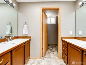 Primary ensuite with dual vanities.