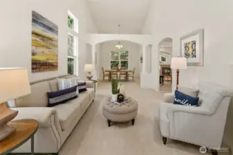 Formal living room with soaring vaulted ceiling. Interior has been freshly painted.