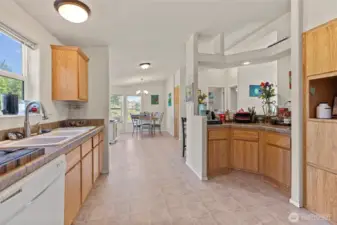 Light, bright kitchen in 2nd home with pantry, eat-in counter, and lots of storage space