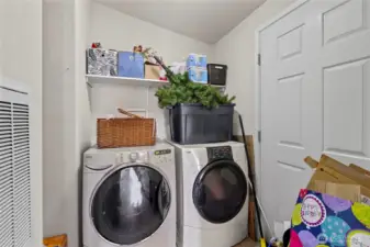 Laundry room in 2nd home with door to tranquil back yard space
