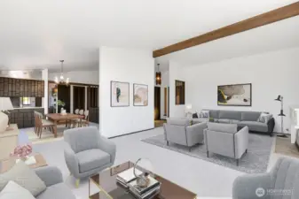 Livingroom looking towards diningroom and kitchen.  These space revel in the Sound view backdrop. Virtual staging.