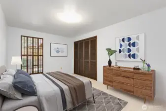 2nd bedroom on main level. The (closed) window looks out into the backyard.