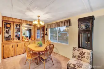 Formal dining room open to the kitchen area. Space for 6+ table and seatings. Modern built in hutch for fine china or collectibles.