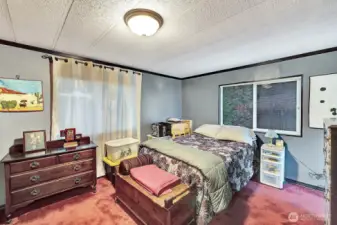 Primary bedroom and 4-piece bath are full length of the back of the home. Spacious room will easily accommodate a King size bed and additional furniture. Double door closet with room for all his and her belongings