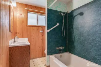 The home has a full bathroom located off the living room hallway.