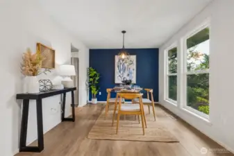 Perfect for entertaining, the dining area provides ample space for meals in or hosting guests. The accent wall adds a pop of style and sophistication, turning everyday meals into something special.