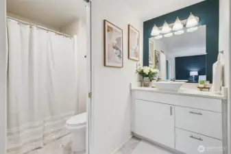The remodeled ¾ Ensuite features modern tile, a stylish vanity, and updated fixtures. You'll appreciate the generous walk in closet.
