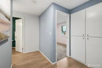 Large open hallway serves the three bedroom. Lots of storage with three separate hall closets.