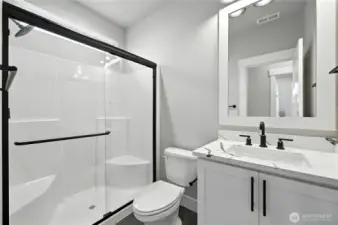 Main Floor 3/4 Bath - photos of same plan built on a different lot. Details will vary