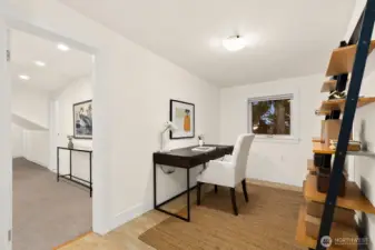 As we head upstairs, you will find another bonus space off of the Primary.  This is the ultimate work from home set up or a perfect nursery!