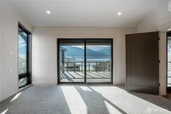 Primary bedroom is large enough for a king size bed and also features an en suite bathroom.