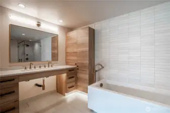 Spacious bathroom counter in the en suite primary bathroom with halo-illuminated mirror.