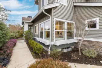 Beautifully-landscaped walkway leads to the private entry