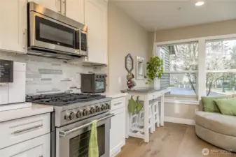 Cook like a pro with this impressive 6-burner gas range, set against a stylish tile backsplash