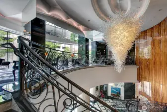 grand 2 story lobby with 2 zoom office room