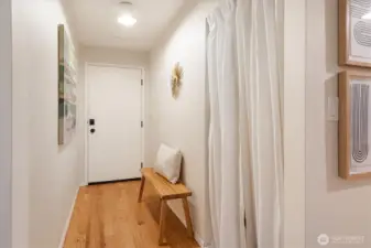 View back at the front door in the hallway to the living room.