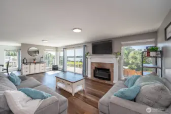 Gorgeous Living area just off the entryway featuring wood fireplace