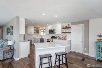 Tastefully modernized kitchen With island for quick snacks!