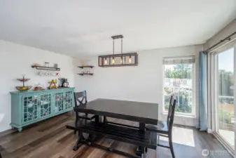 Dining area with more big windows and patio access. Enjoy the lake views while enjoying your meals!