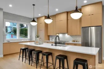 Fabulous kitchen with full height cabinets, large island, walk-in pantry