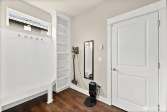 mudroom with built-in bench and shelving