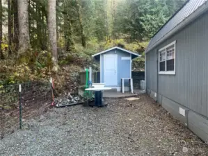 Storage sheds on both sides of house.