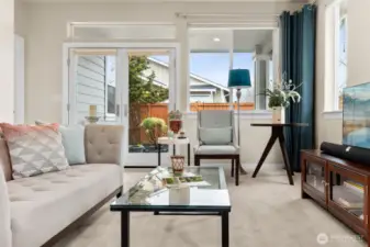 Open and spacious living room with access to covered back patio.