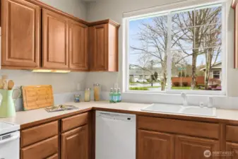 Large window with view of the neighborhood