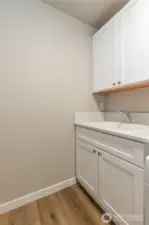 Upper level laundry area of like home