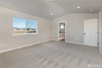 Large primary bedroom with vaulted ceiling, like home