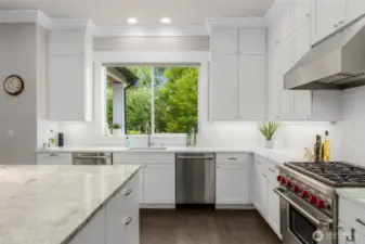 Kitchen overlooks the expansive back yard so you can keep an eye on activity in back while prepping meals and washing dishes