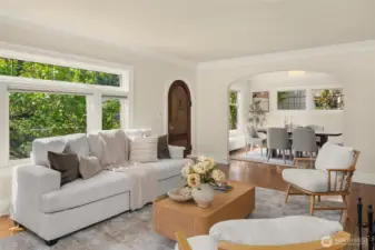 From this angle, you can see the front door and beyond that archway, the dining room.