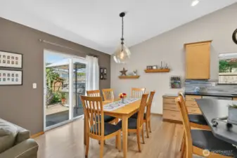 Dining room off the kitchen. Custom lighting over the dining table.