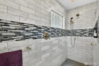 Large walk in shower all tile with dual shower heads. Beautifully done!