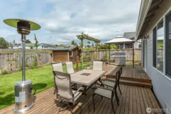Nice garden shed for potting and storage. Pergola on the deck stays with the house.