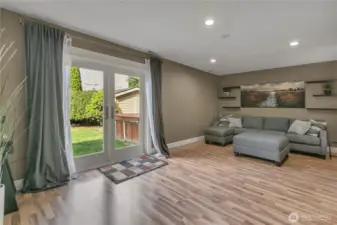 As you enter the family/media/play room, you'll see how spacious it is plus the second set of French doors lead to the private back yard.
