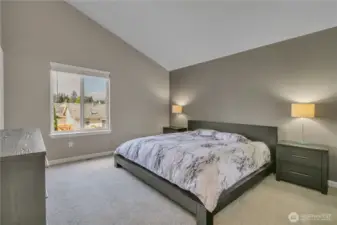 The spacious primary suite located upstairs has vaulted ceilings, walk-in closet plus it's own ensuite bathroom with double sinks.