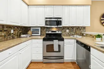 The kitchen has a generous amount of counter space and storage.