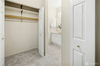 Ample closet space between the primary bedroom and bath.