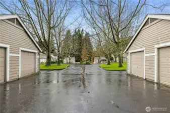 The detached one-car garage is on the right. The extra dedicated parking space is the first space to the right of the garage.