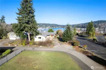 This charming vacant parcel is tucked away on a quiet dead end street, offering privacy while being just moments from the waterfront.  Year round view of the harbor and Puget Sound