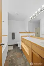 Primary bathroom includes soaking tub and double sinks.