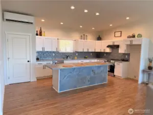 Spacious kitchen with eating area, ample storage, and pantry