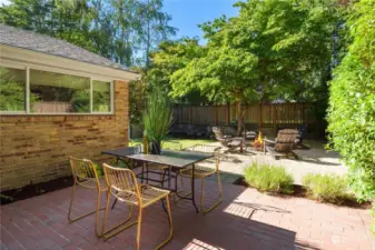 As you enter the fenced backyard you are engulfed in privacy and beautiful landscaping. This brick paver patio is a wonderful outdoor space for entertaining.