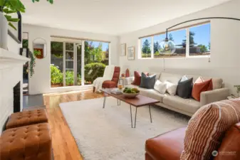A spacious and very versatile living room brings the outside in with abundant windows while maintaining fantastic privacy.