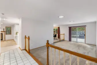 Living room off of kitchen with access to backyard