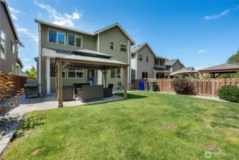 Rear yard is fenced and has a covered patio with an extended patio for the gazebo with lights. Yard was professionally designed with sprinkler system, french drains and a drip system for your hanging baskets.  Air conditioning unit added keep the house comfortable upstairs and down.