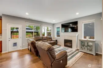 Living room features gas fireplace with mantle.