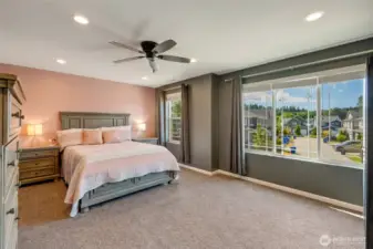 Another view of the bonus room with ceiling fan.