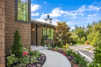 Elegant landscaping and artful stone rockeries throughout property